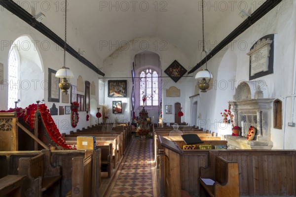 Church of Saint Gregory decorated with Remembrance poppies and wreaths, Hemingstone, Suffolk,