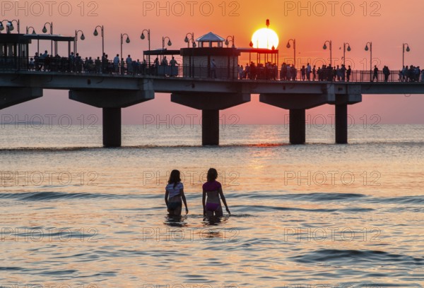 Sunset at the pier in Miedzyzdroje, Western Pomerania, Poland, East Europe, Europe