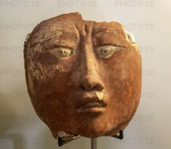 Face with eye squint, from Naachtún, Late Classic period, Mayan archaeological museum, Fort San