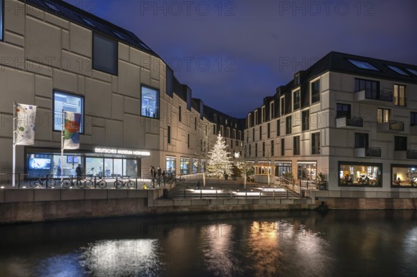 Night view of the Neues Museum Nuremberg, the Museum of the Future on the Pegnitz, Nuremberg,