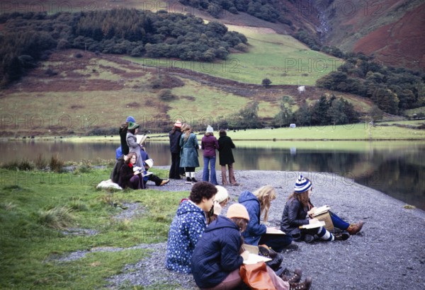 Secondary school girls doing geographical fieldwork, United Kingdom 1970s Girls sitting on the