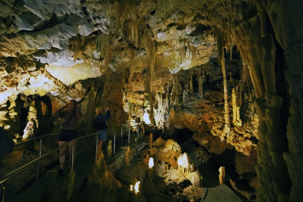 Cave with illuminated stalactites and stalagmites, stalactite cave, Diros Cave, Glyfada Cave,