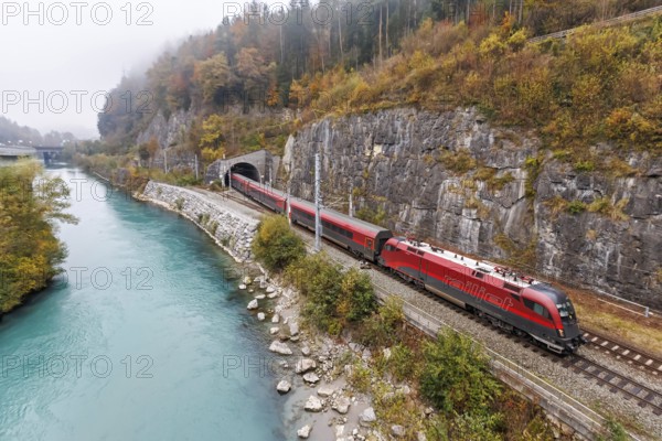 Railjet railway passenger train of the Austrian Federal Railways ÖBB on the Arlbergbahn in autumn