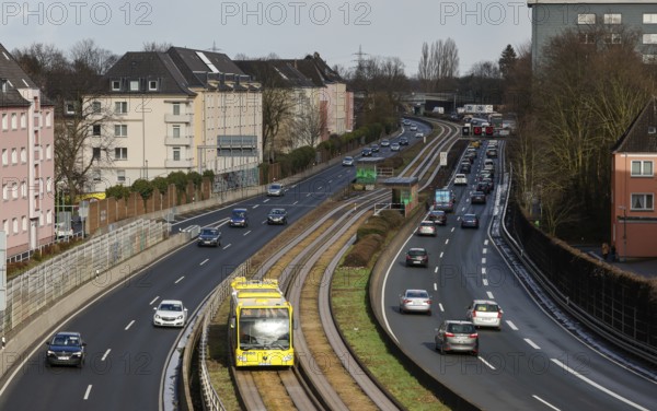 Essen, North Rhine-Westphalia, Germany - Cars and a public bus drive through Essen city centre on