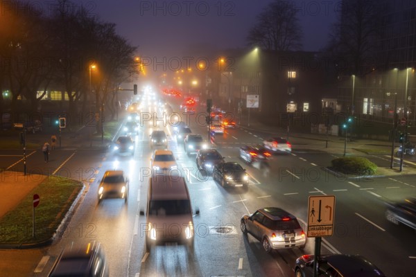Dense fog, with visibility sometimes less than 100 metres, city centre traffic at rush hour on
