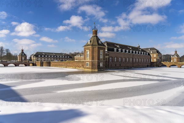 The snow-covered Nordkirchen Castle in winter, Nordkirchen, Münsterland, North Rhine-Westphalia,