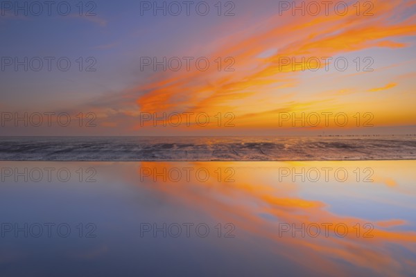 View of a tidal flat in the Wadden Sea at low tide at sunset, National Park, Unesco, World Natural