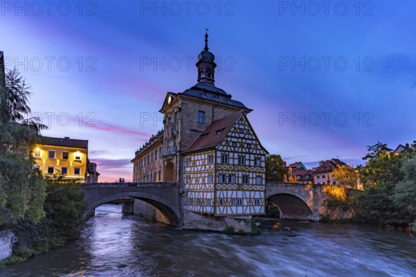 The Old Town Hall in the river Regnitz at dusk, Old Town of Bamberg, Upper Franconia, Bavaria,