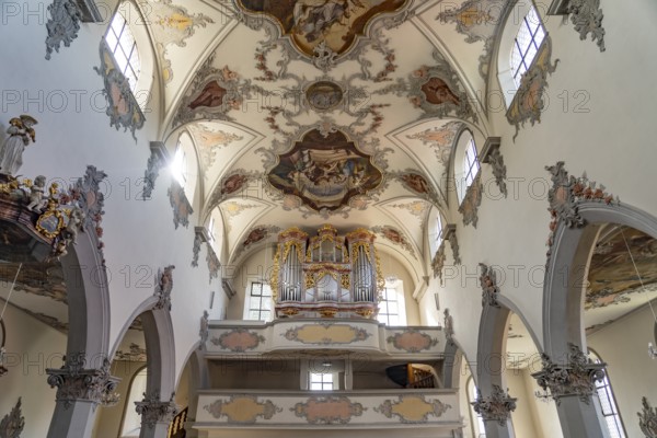 Church organ and ceiling fresco in the interior of the town church of Laufenburg, Aargau,