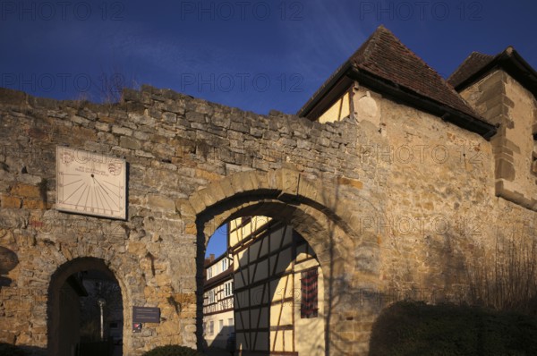 Grave gate with sundial, Schiller town of Marbach am Neckar, evening light, Baden-Württemberg,