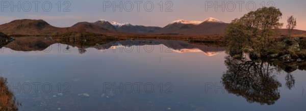 Mountains reflected in lake, morning light, morning mood, still, autumn, snowy, panorama, Lochan na