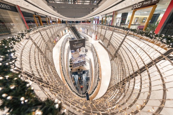Large shopping centre with escalator and festive decorations, Stuttgart, Königsbau Passage,