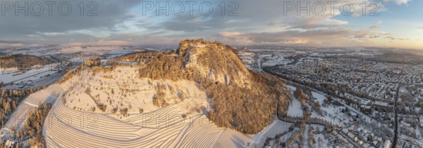 Aerial view, panorama of the snow-covered Hegau volcano Hohentwiel with Germany's largest castle
