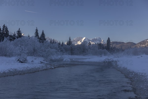 Isar valley in winter at temperatures of minus 18 degrees Celsius. Snow covered landscape with the