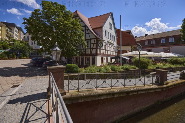 Erbacher brewhouse, restaurant, half-timbered house, river Mümling, metal railing, lantern, blue