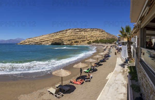 Matala beach with a view of the rock caves, south coast, Crete, Greece, Europe