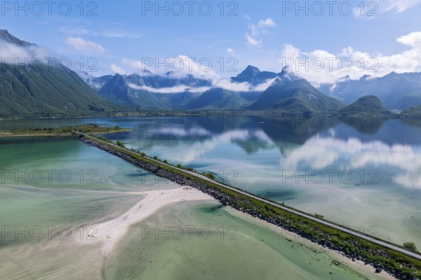 Fjord and mountains of the island Austvågøya, road on dam, Grunnførfjorden, Lofoten, Norway, Europe