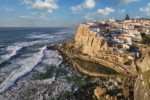 Scenic view of the seaside Azenhas do Mar fishing village on cliff on Atlantic ocean coast,