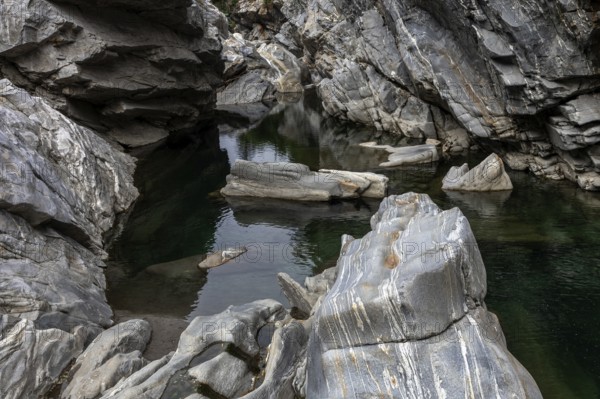 Rocks, granite rock formations in the Maggia River near Ponte Brolla, in the Maggia Valley, Valle