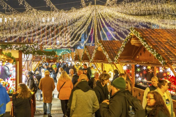 Pre-Christmas season, people, shoppers, visitors to the Christmas market in the city centre of