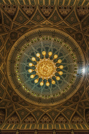Dome and illuminated chandelier in the Sultan Qaboos Mosque, Muscat, Arabian Peninsula, Sultanate