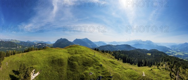 Drone shot, at the summit of the Taborberg with a view of the Osterhorn group and Dachstein massif,