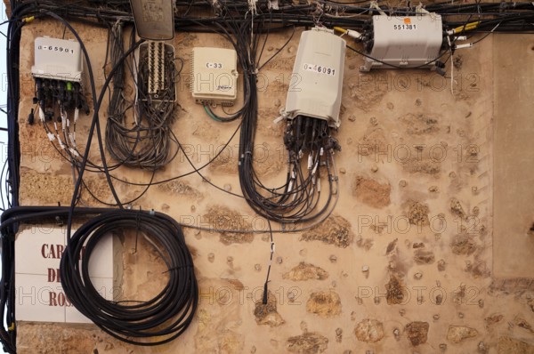 Electrical cables, laid on the outside of the house wall, Valldemossa, Tramuntana Mountains, Serra