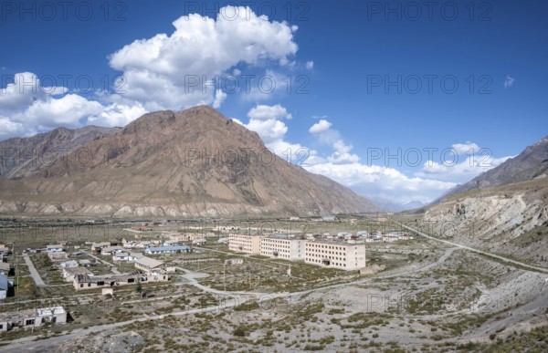 Abandoned ruined buildings in a mountain landscape, ghost town, Engilchek, Tian Shan, Kyrgyzstan,