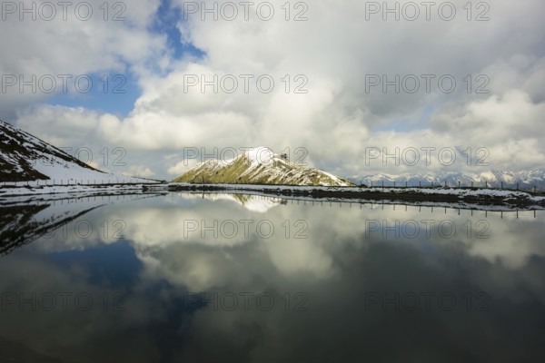 Riezler Alpsee, an artificial lake, snow pond, feeds the snow cannons that completely cover the