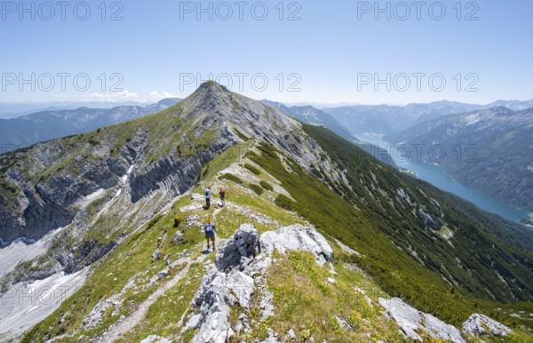 Mountaineer on the hiking trail on the summit ridge of the Unnütz, behind Achensee, Unnütz