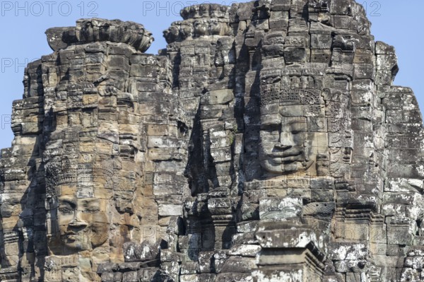Panoramic image of giant stone-carved faces of the Bodhisattva Lokeshvara, also known as