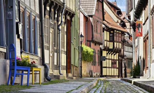 Idyllic narrow alley with half-timbered houses and cobblestones in the historic old town, UNESCO
