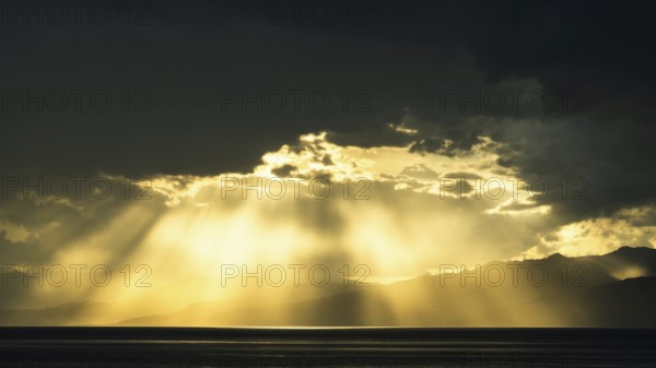 Sun rays in the clouds over Sicily, Tyrrhenian Sea, Italy, Europe
