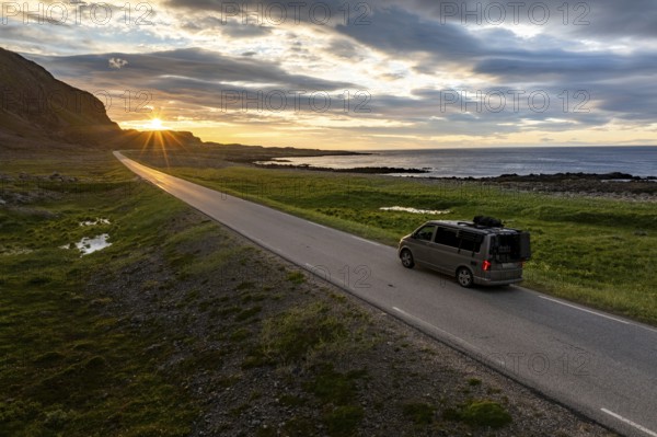 Camper van travelling along the road to Berlevåg, VW California, Barents Sea, Varanger, Finnmark,