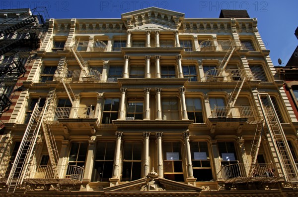 Neoclassical house facade with fire escapes, Downtown, New York City, USA, North America