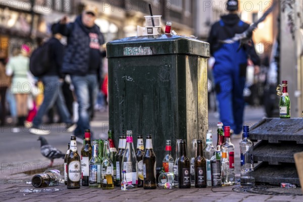 Rose Monday carnival parade in Düsseldorf, old town, empty bottles, various alcoholic beverages, at