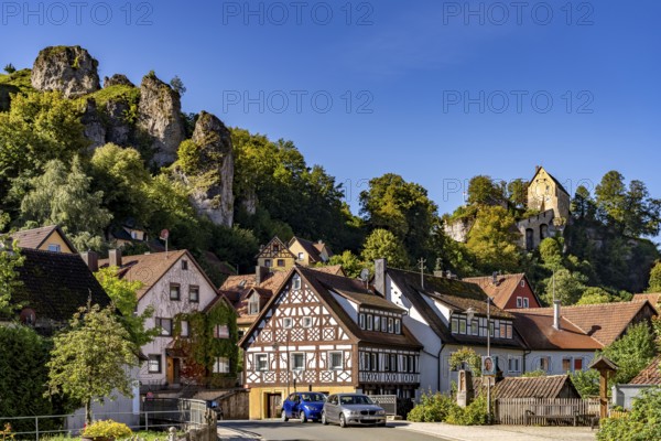 Half-timbered houses and the castle in Pottenstein in Franconian Switzerland, Bavaria, Germany,