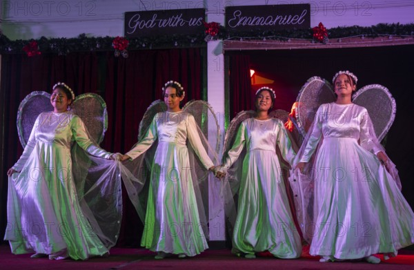 Artists perform in a nativity depicting the birth the baby Jesus on the Christmas eve, at a Church