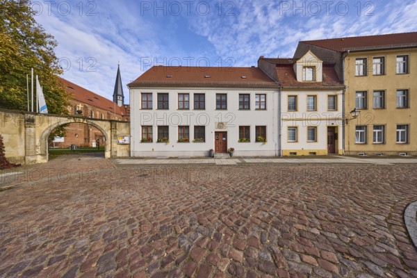 Marienstern Monastery, wall with archway, houses with windows and pointed roofs made of roof tiles,