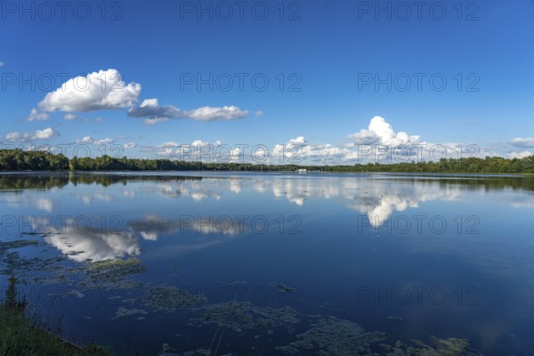 Clouds reflected in the Danube reservoir Faimingen, Lauingen Donau, Bavaria, Germany, Europe