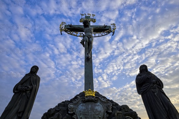 Crucifix and stone statues, Charles Bridge, Prague, Czech Republic, Europe