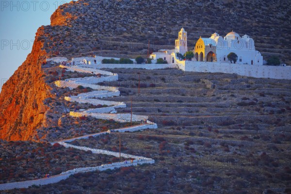 View of Panagia Kimissis church built on a cliff above the sea, Chora, Folegandros Island, Cyclades
