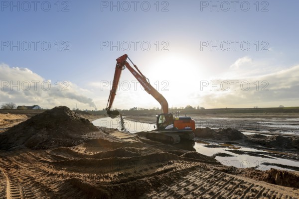 Dinslaken, North Rhine-Westphalia, Germany, Excavator in the construction site of the new Emscher