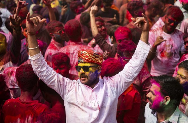 Revellers smear with Gulal or coloured powder and dance to play Holi, the Hindu spring festival of