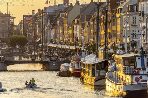 Colourful houses, restaurants and historic ships on the Nyhavn canal and harbour, Copenhagen,
