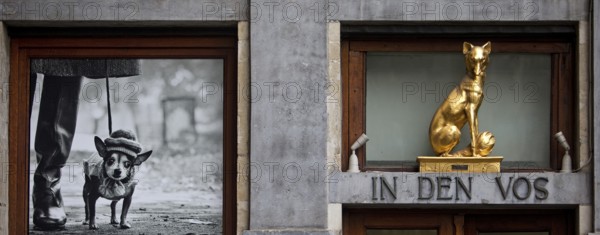 Baroque façade detail of the Guildhall In den Vox with photo exhibition by Elliott Erwitt,