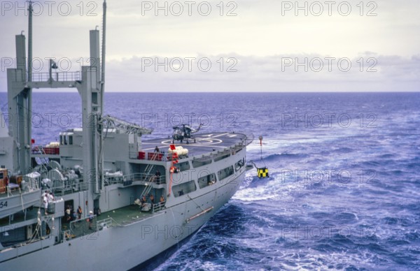 Helicopter on deck, aft end RFA Lyness ship in Atlantic Ocean, Royal Navy, slide dated April 1972