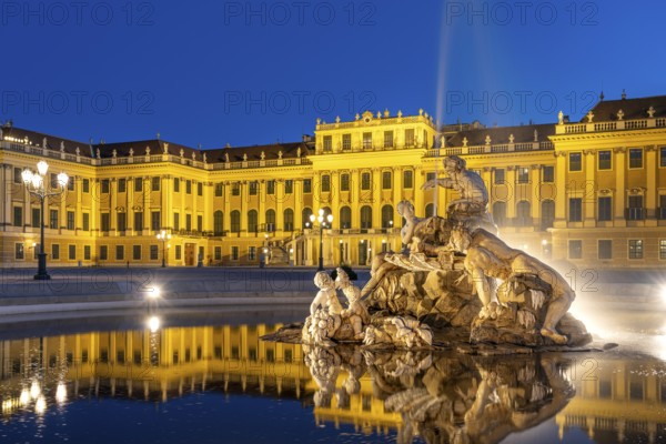 Fountain in the courtyard of honour at Schönbrunn Palace at dusk, UNESCO World Heritage Site in