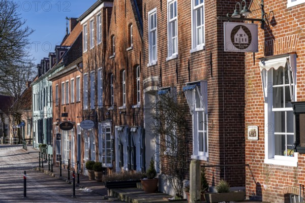 The fishing village of Greetsiel, municipality of Krummhörn, historic houses at the fishing
