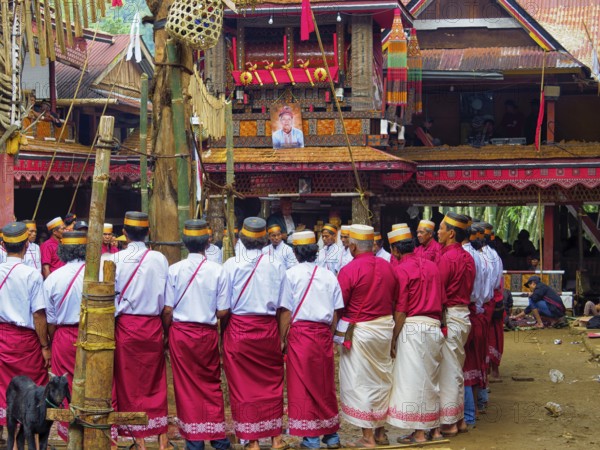 Men in traditional festive dress, funeral ceremony, Tana Toraja, Sulawesi, Indonesia, Asia